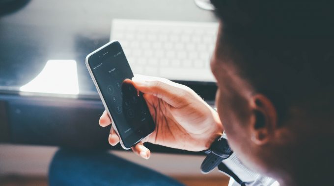 A man holds a phone.