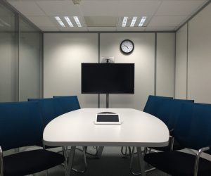 An empty conference room to represent the teleconference.